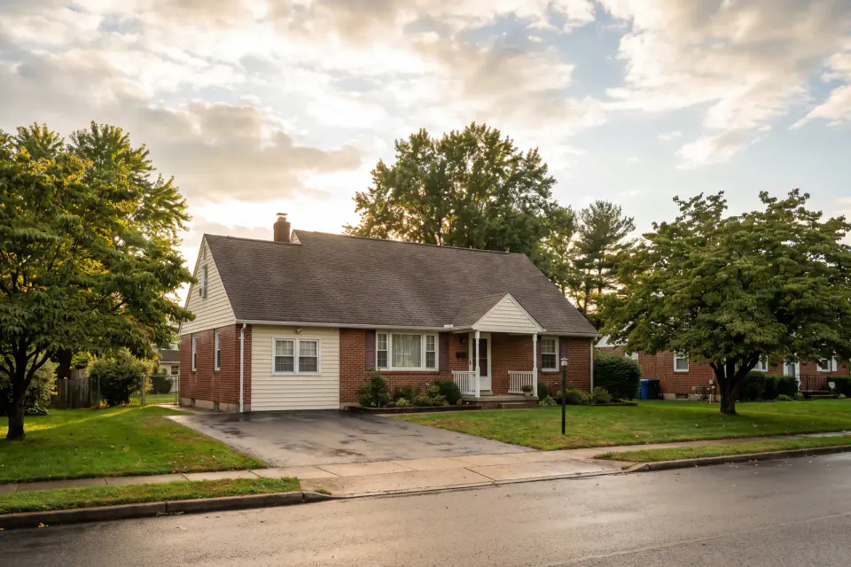 Postwar detached homes on a leafy Levittown street in Bucks County Pennsylvania